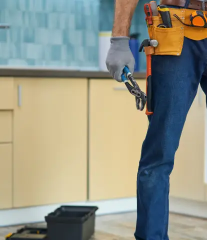 cropped-shot-of-repairman-plumber-wearing-a-toolb-2025-03-13-07-21-29-utc.webp